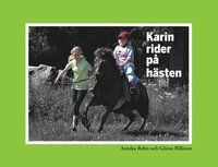 Karin rider på hästen